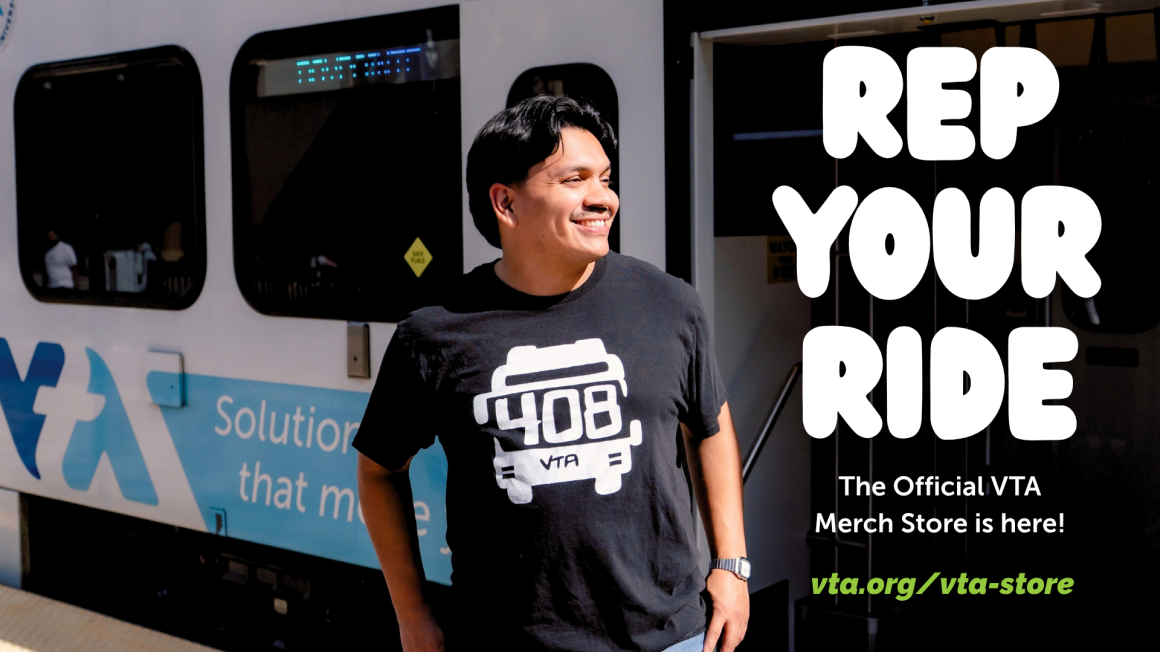 Rep your ride. The official VTA Merch Store is here! Male wearing 408 VTA bus black tshirt standing next to a light rail