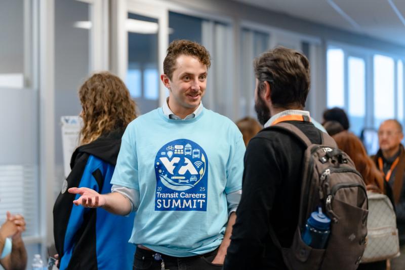 VTA staff talking to an attendee at the summit