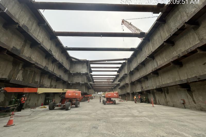 launch shaft for tunnel boring maching with trucks and workers