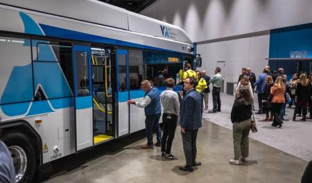 Conference attendees looking at VTA bus