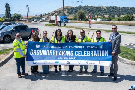 photo of COPE team members with banner
