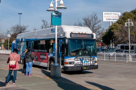 VTA bus with people walking toward it