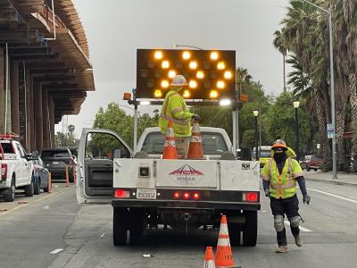 construction worker and truck in street