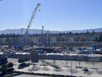 large crain construction site people working