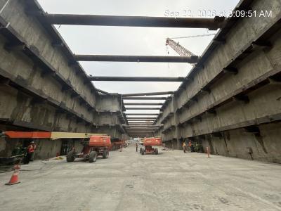 launch shaft for tunnel boring maching with trucks and workers