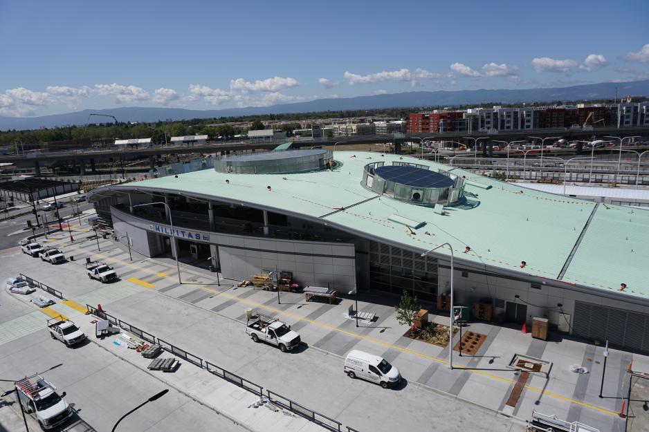 S2-C6.2-G2_BART_Milpitas.jpg A photo of the Milpitas BART station with apartment buildings in the background.