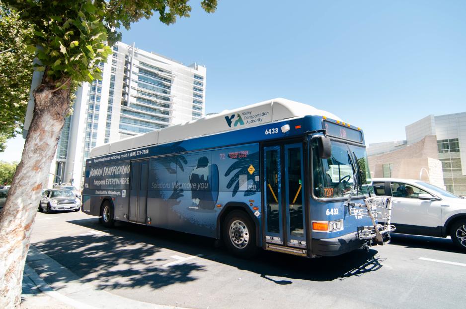 VTA bus with human trafficking public education information VTA bus with human trafficking billboard showing a boy and girl and a phone number