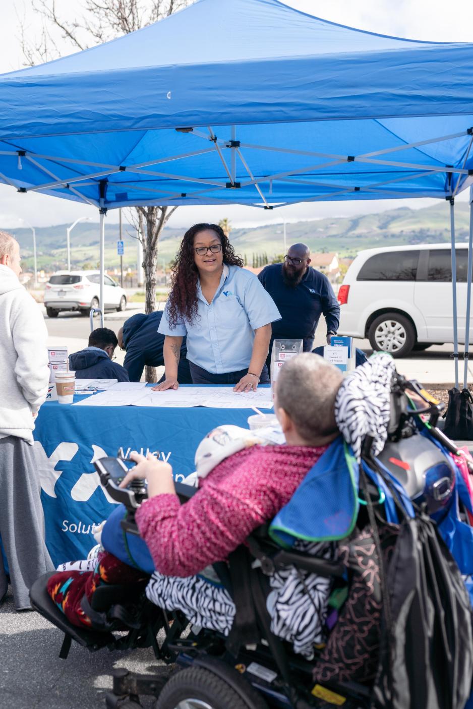 image of customer service representative talking to a paratransit customer