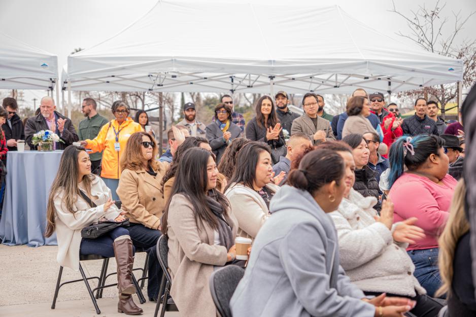 people sitting in seats listening to speakers