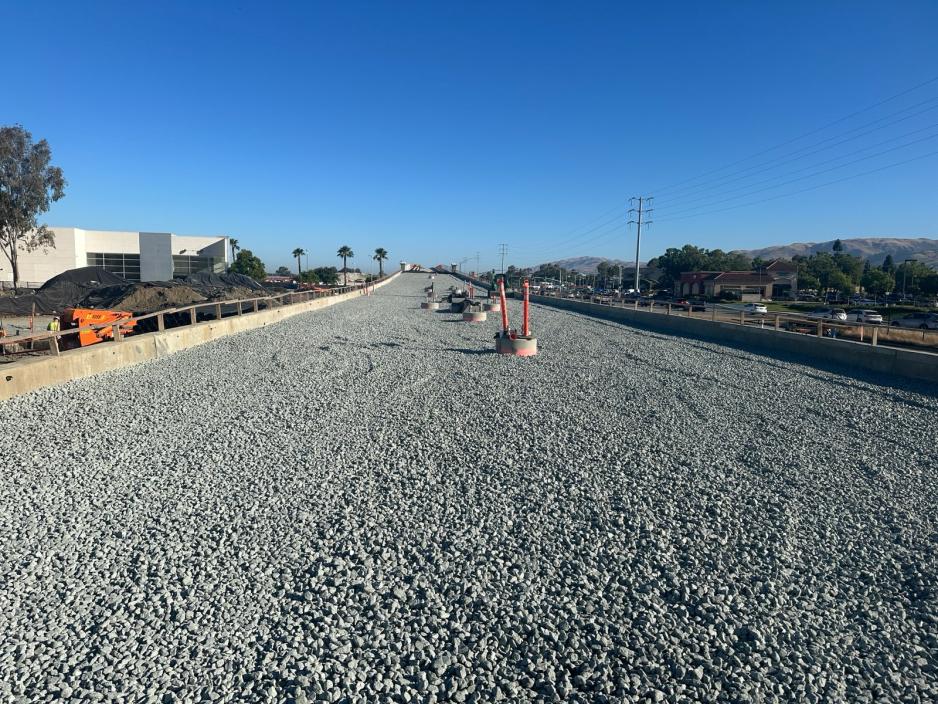 Spreading ballast on the track section at Eastridge. 