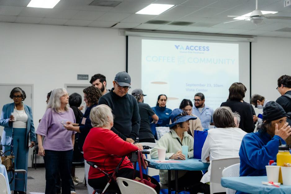 A group of VTA ACCESS riders and staff gather around tables and talk during the Coffee with the Community event at the Vista Center for the Blind and Visually Impaired in San Jose.